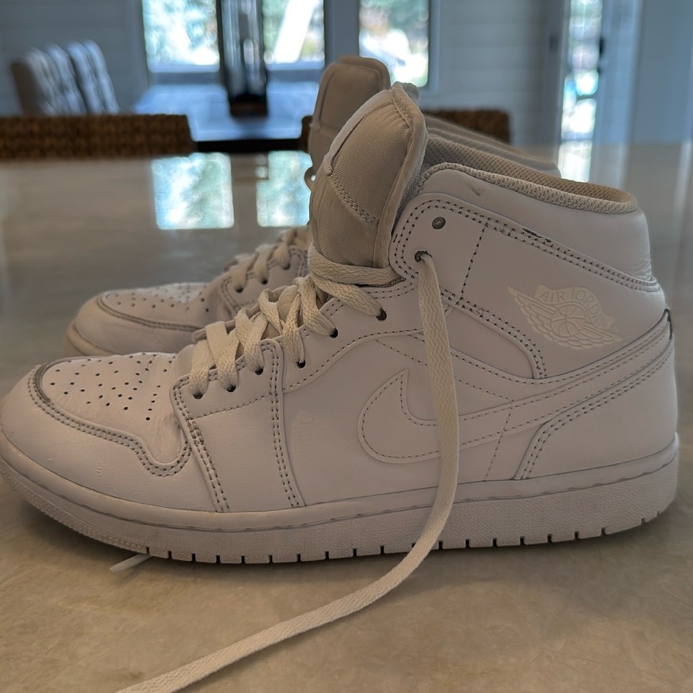 All white Air Jordan shoes